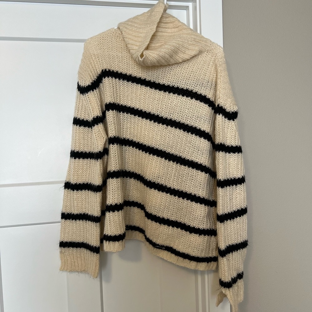 Elegant Striped Turtleneck Sweater in Cream and Black